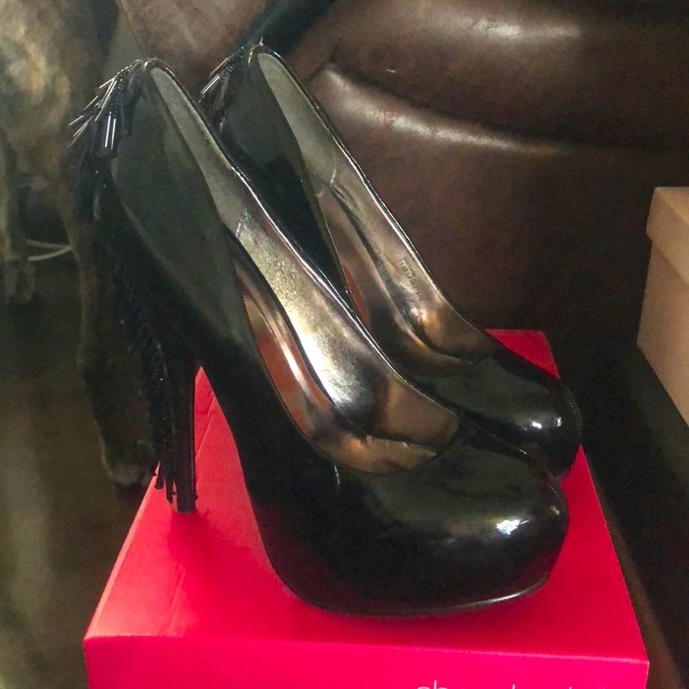 Black hells with tassels on heels
